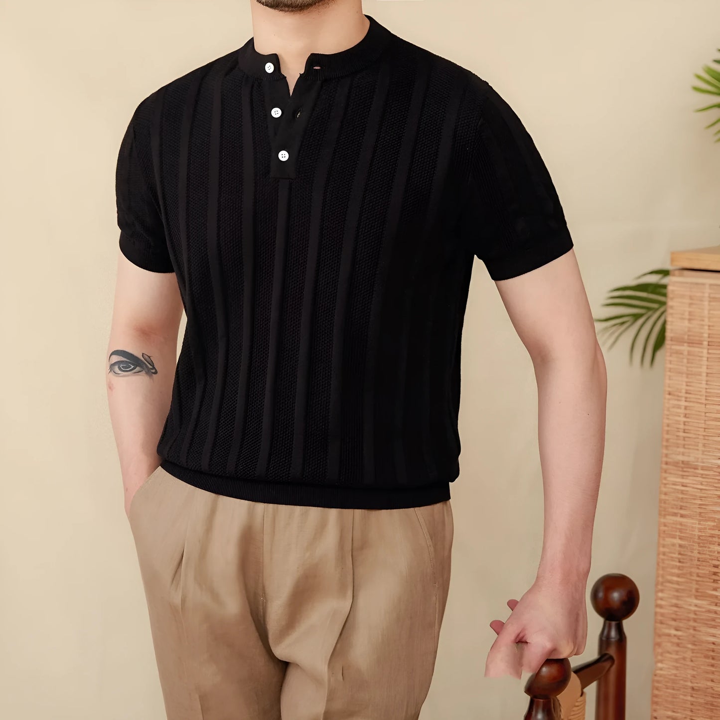 Men's creamy-white cotton T-shirt with a Henry collar and subtle sunken stripe pattern on the chest.