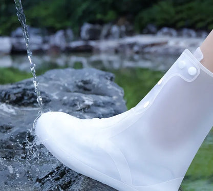 White high-top PVC waterproof shoe cover for women, shown on a foot.