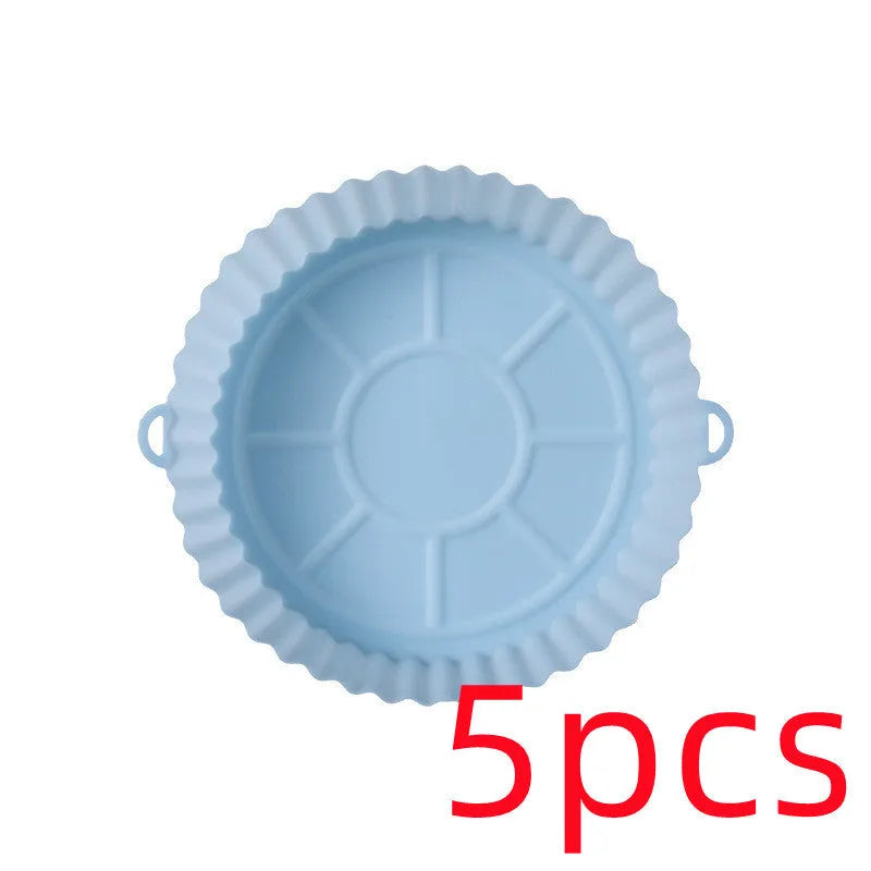 Round blue silicone baking tray mat with 4.5cm sides on a kitchen counter.