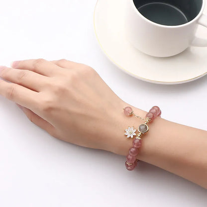 Korean Mori style crystal bracelet with a strawberry quartz bead and floral electroplated metal details