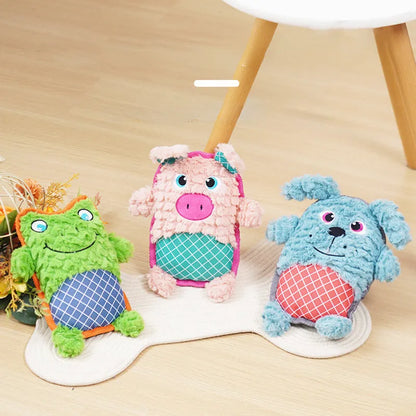 Blue, green, and pink stuffed plush dog toys with squeakers for bite-resistant chewing.