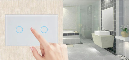White tempered glass smart touch light switch with blue LED indicator on a UK wall.
