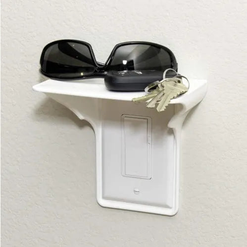 White polypropylene socket organiser rack for drive tools, 14cm long on a workshop bench.