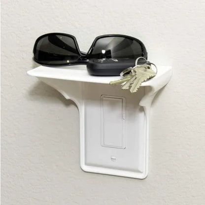 White polypropylene socket organiser rack for drive tools, 14cm long on a workshop bench.