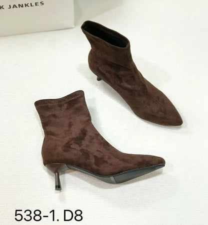 Women's black pointed toe ankle boots with a stiletto heel on a neutral background