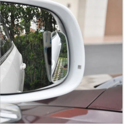 Glass adjustable blind spot rearview mirror with sponge adhesive backing for car installation.