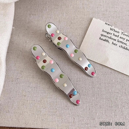 Silver metal hair barrettes with hollow heart pattern and duckbill clip design