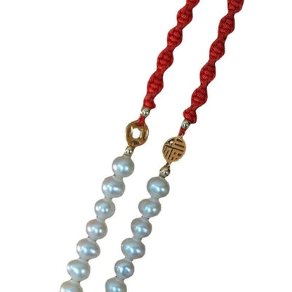Women's pearl bracelet with braided red rope and geometric fu character charm
