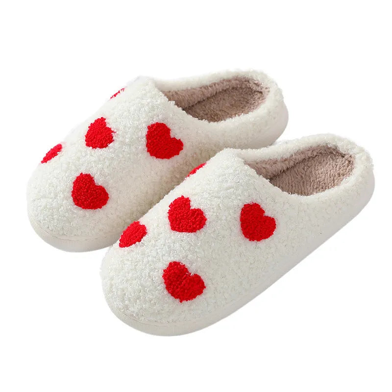 Adult women's plush home slipper in a cartoon love design with a round toe and non-slip PVC sole.
