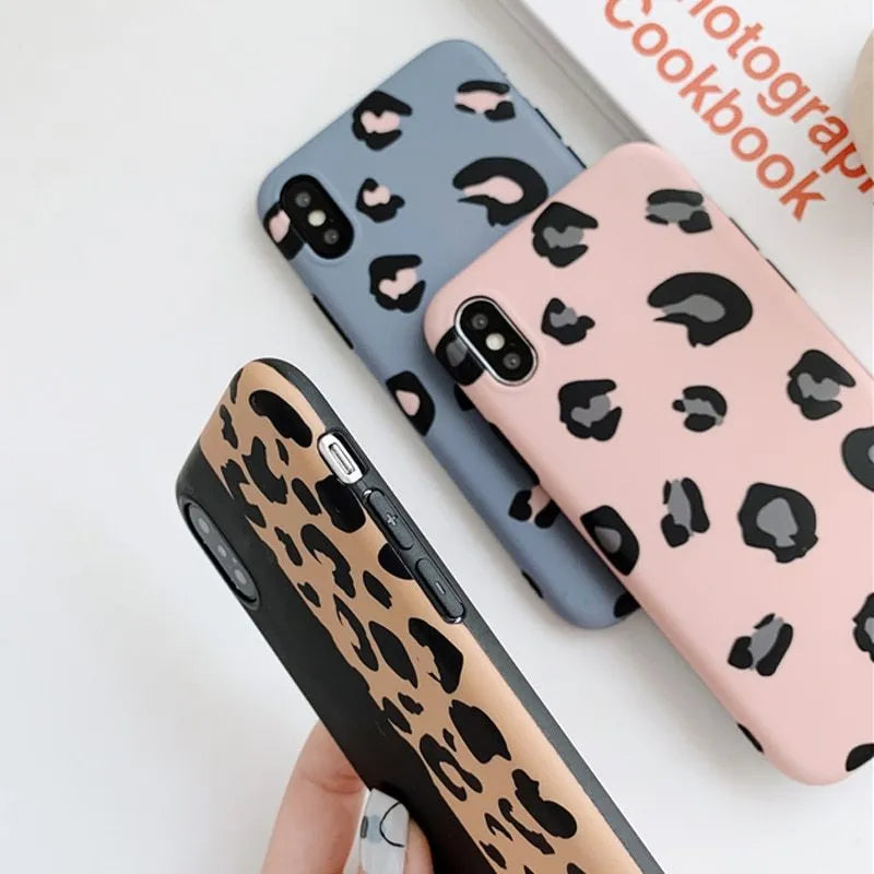 Leopard print protective phone case for iPhone, shown in black, blue, and pink colour options.