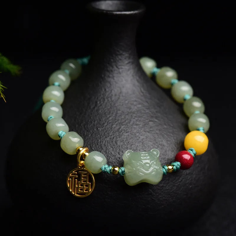 Natural Hetian Jade bracelet with animal Zodiac designs and cinnabar beeswax accents