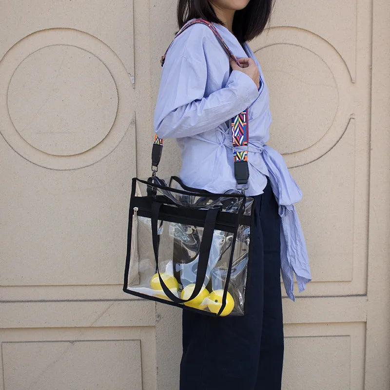 Clear PVC women's messenger bag with a coloured front panel and double shoulder straps.