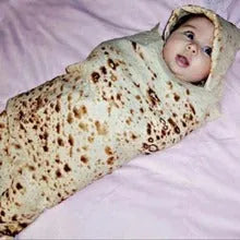 Round flannel burrito blanket with food-themed printing, showing coral fleece texture and wrap-style design