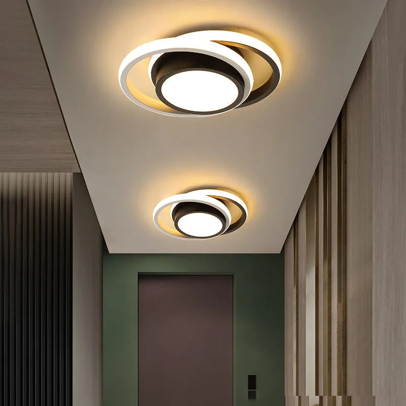 Modern geometric aluminium ceiling light in round and square styles with LED illumination.