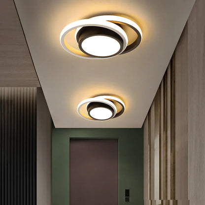 Modern geometric aluminium ceiling light in round and square styles with LED illumination.