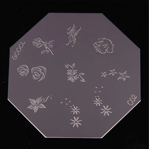 White plastic nail art stamping machine with six stainless steel pattern plates on wooden desk