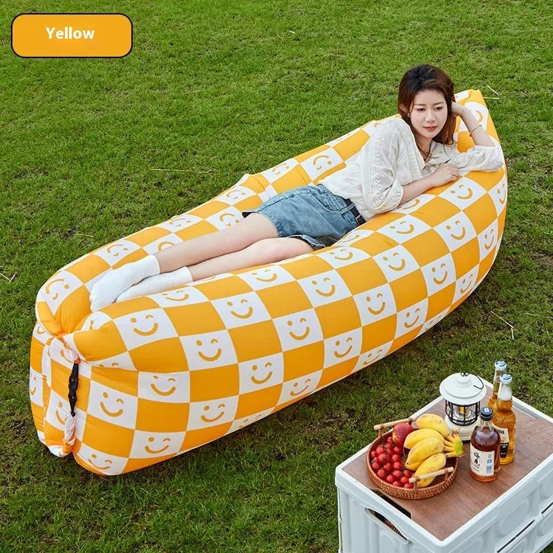 Yellow smiling face pattern inflatable portable seat for outdoor use