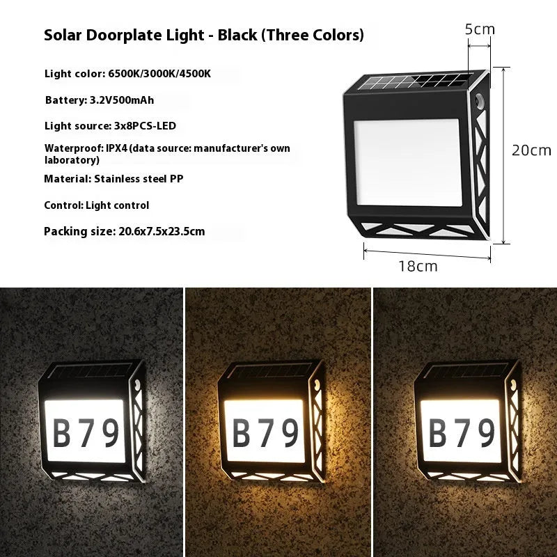 Black solar doorplate light with LED illumination showing house numbers