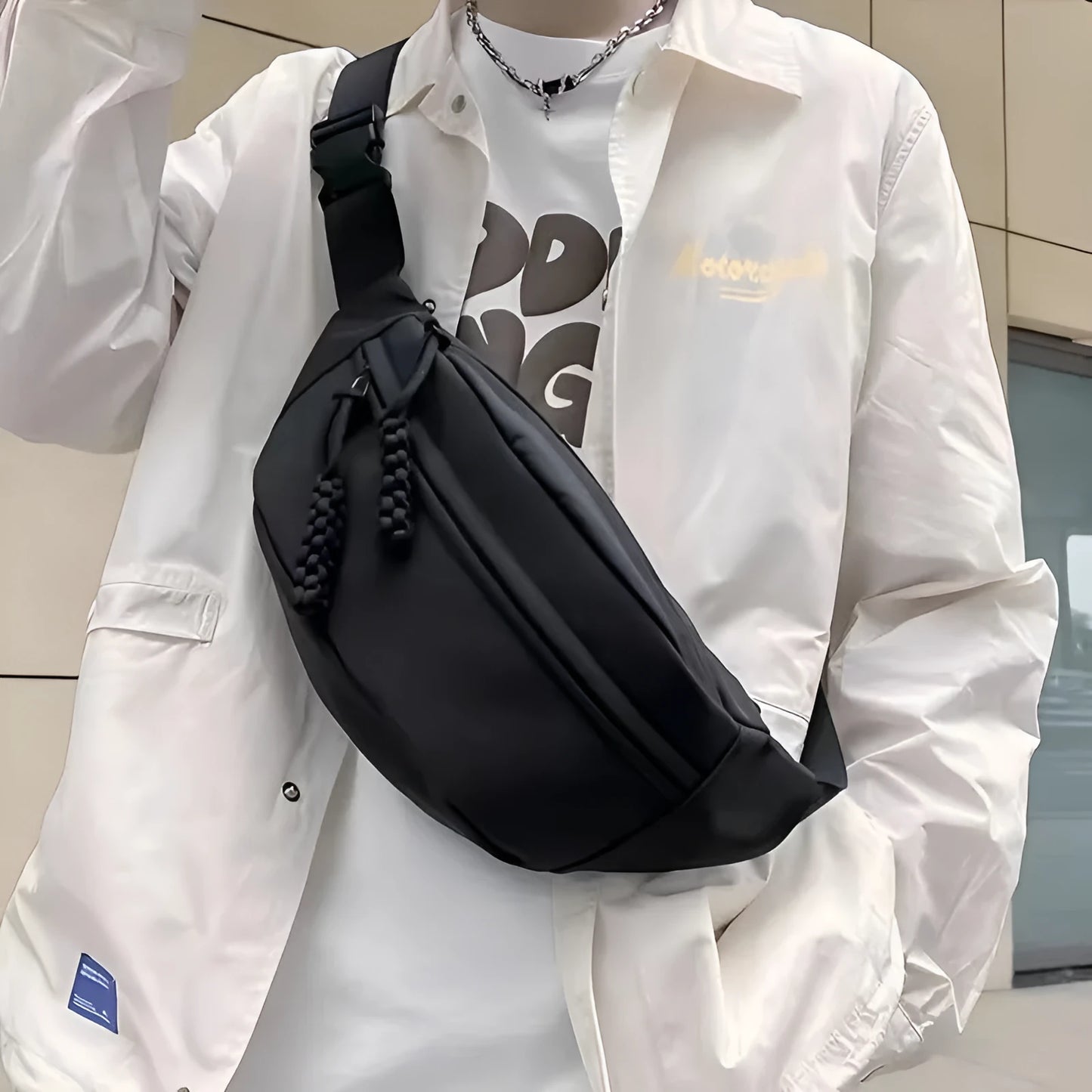 Men's small black polyester crossbody chest bag with adjustable strap.