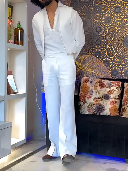 White three-piece outfit with V-neck shirt, sleeveless vest and trousers on hanger