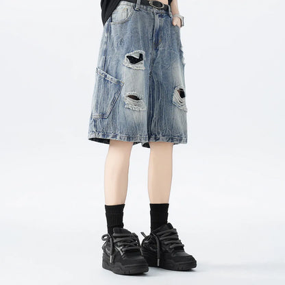 Mens loose fit ripped denim shorts in washed blue and black retro style