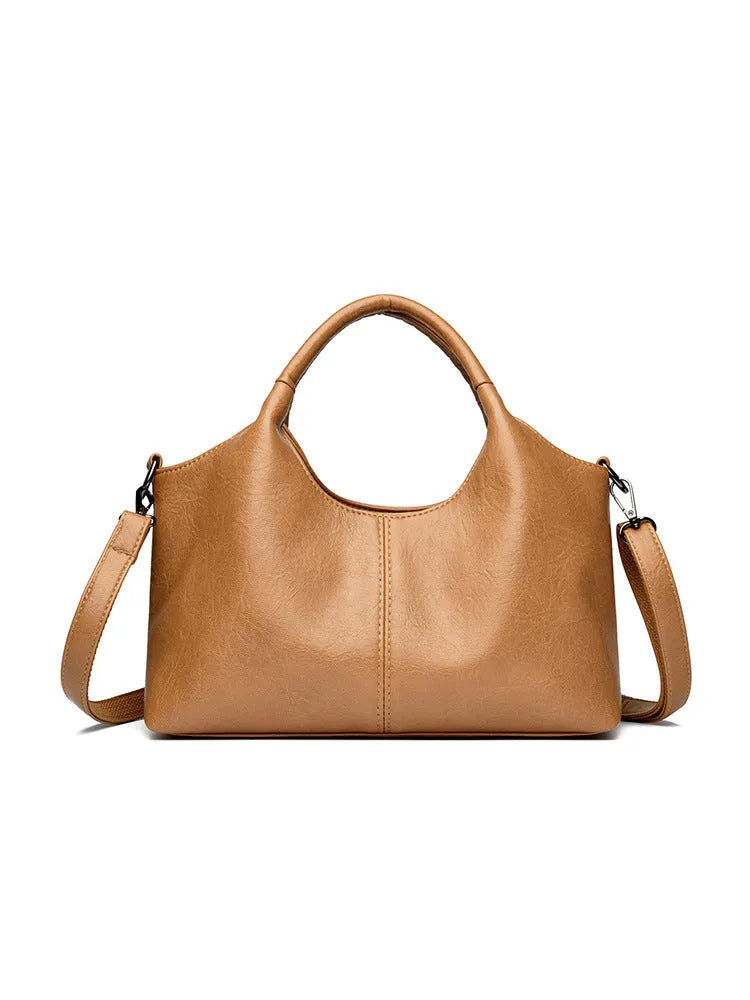 Women's soft genuine leather large crossbody bag shown in available colours: black, brown, wine red, yellow, beige, bronze, green.