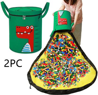 Green felt storage cube with pull rope, unfolded flat as a square play mat next to toys.