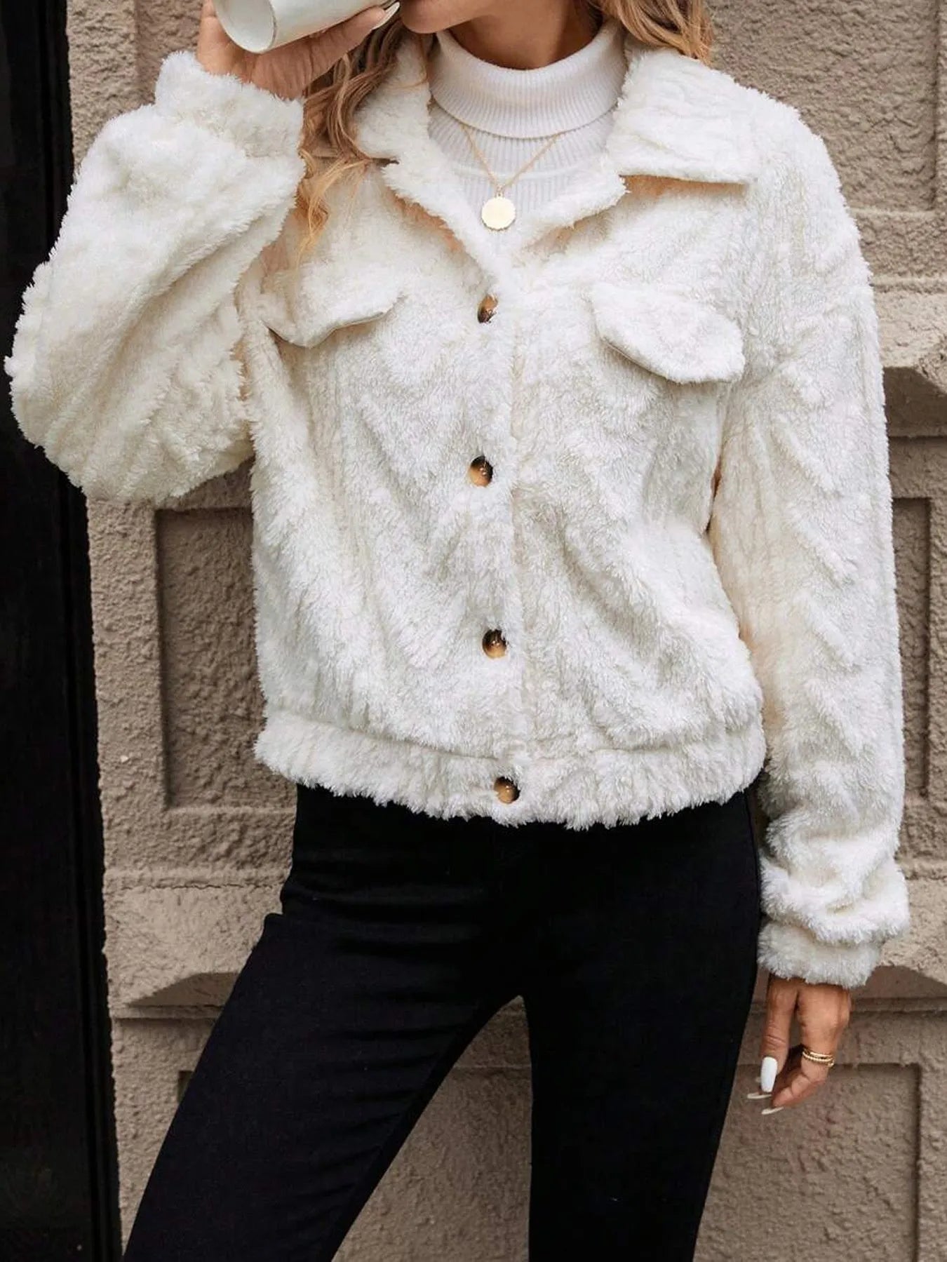 Ivory white women's button-front plush cardigan coat on a hanger