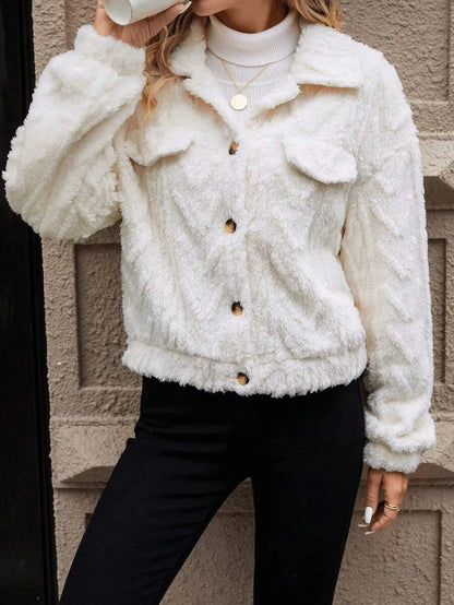 Ivory white women's button-front plush cardigan coat on a hanger