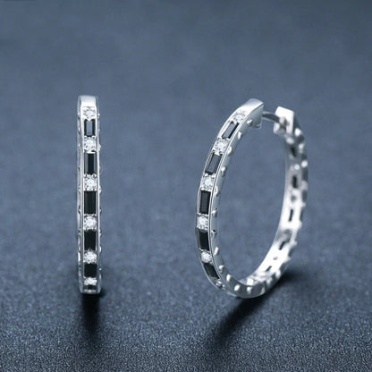 Elegant black zircon earrings featuring a geometric design, crafted from premium copper for a lustrous finish