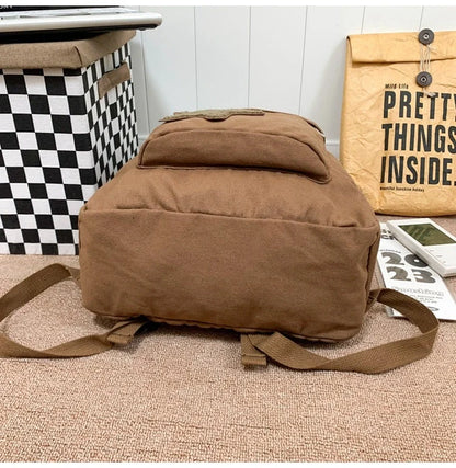Brown canvas backpack with geometric patterns, ideal for female college students