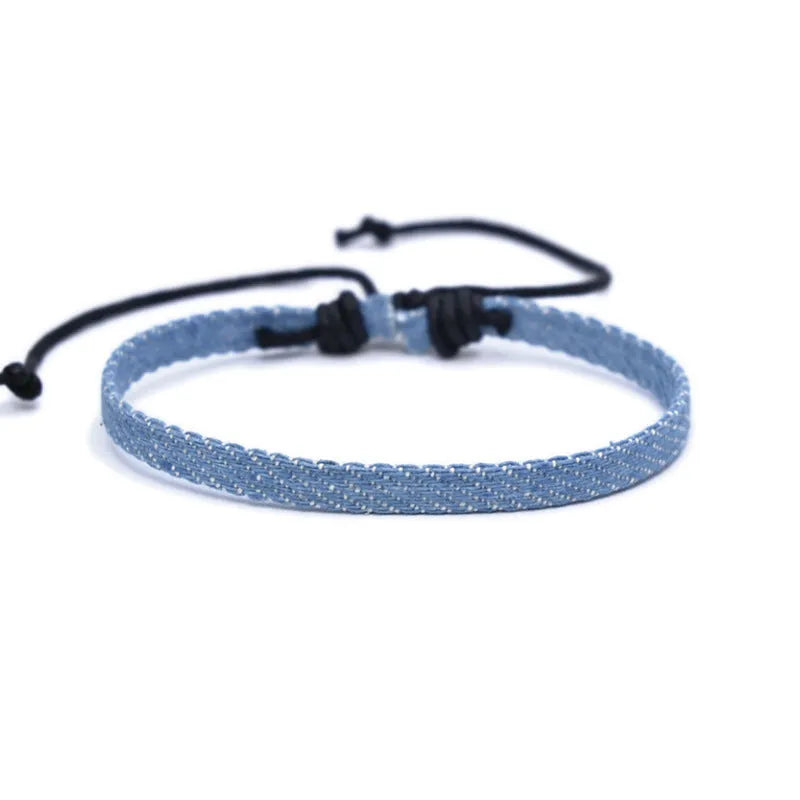 National style denim fabric bracelet carrying strap showing mixed material construction and wristband design