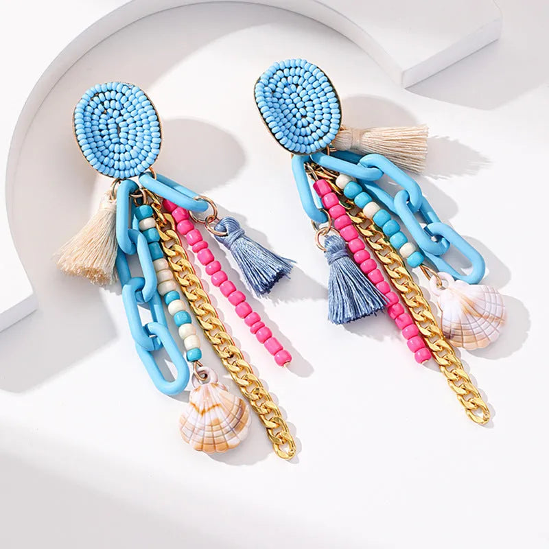 Handmade bohemian shell tassel earrings for women with colourful flower and geometric drop design