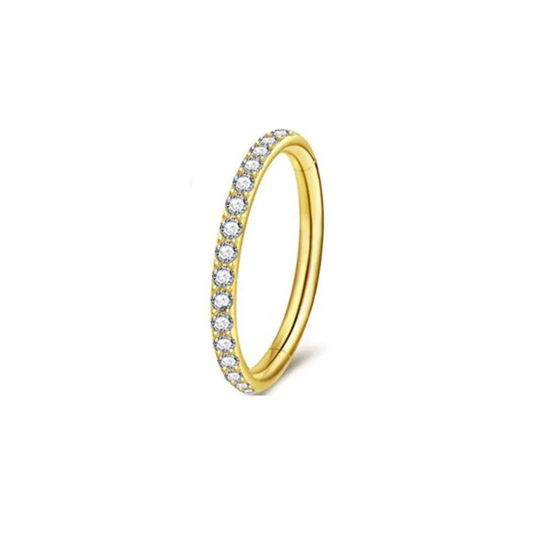 A seamless round hoop nose ring in stainless steel, shown alongside gold and rose gold colour options.