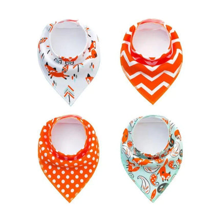 Set of four cotton baby bibs with arrow and wave designs for mess-free feeding