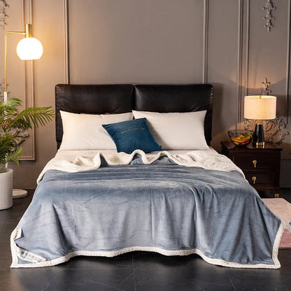 A thick, plain coral fleece blanket in a choice of colours, folded to show its texture.