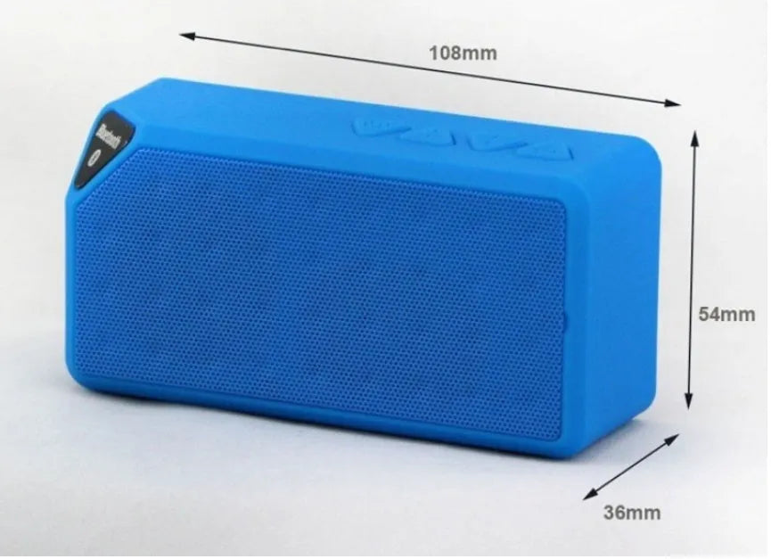 Cannon X3 small cube-shaped wireless Bluetooth speaker in multiple colours on a table.