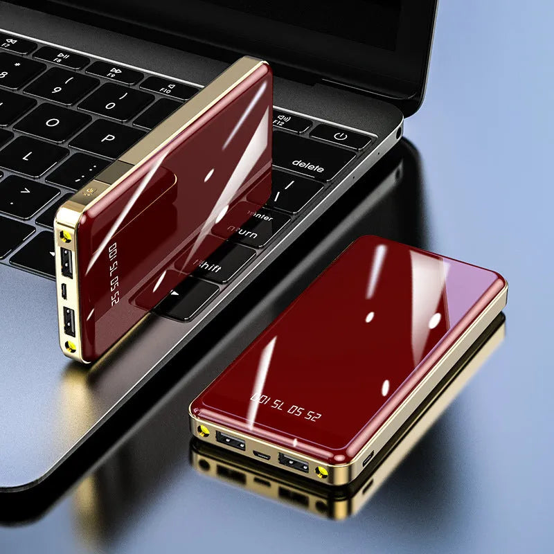 Square-shaped 20000mAh power bank with digital display screen showing battery percentage.