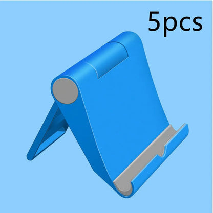 Black PE folding mobile phone stand holding a smartphone at an angle on a desktop.
