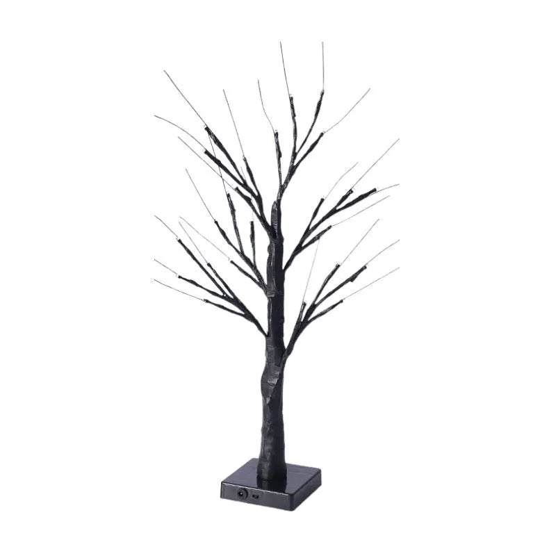60cm tall white LED birch tree night light on a table, available in black, pumpkin, bat, or maple designs.