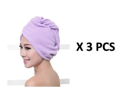 A woman wearing a sky blue microfiber hair dryer cap, with wet hair tucked inside, showing the towel's wrap-around design.