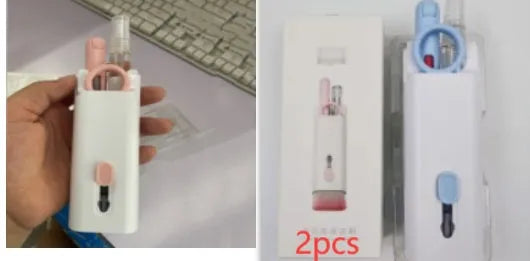 White electronics cleaning kit with a cleaning pen, spray bottle, brush, and keycap puller on a table