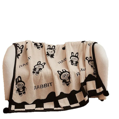 Black and white cationic panda pattern velvet blanket showing texture and modern design
