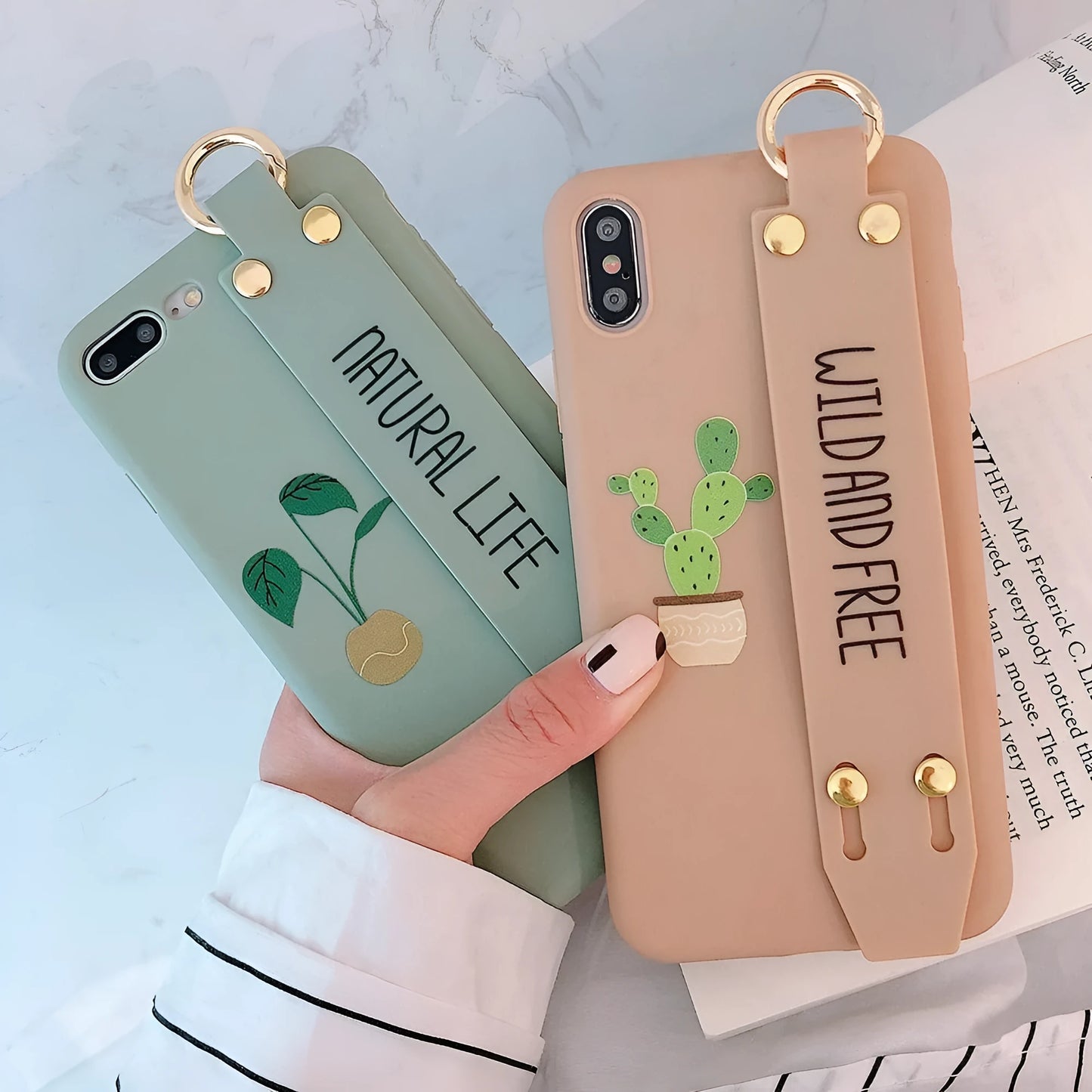 Green iPhone case with graffiti design and integrated wristband holder on back cover