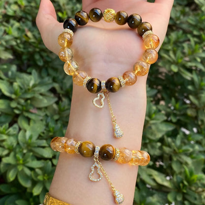 Handmade unisex crystal bracelet with a diamond gourd charm and assorted 10mm and 8mm beads.