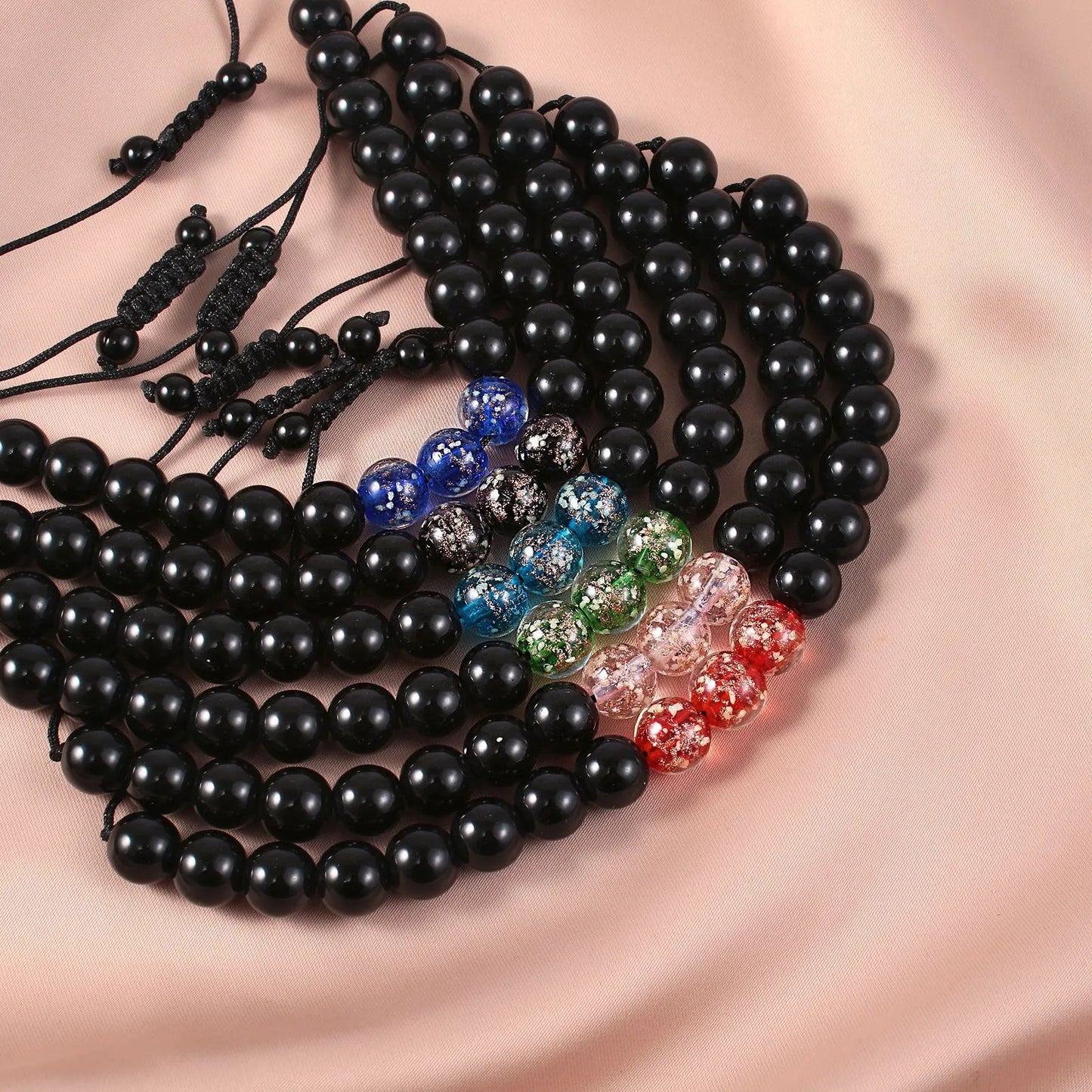 Adjustable luminous beaded bracelet with geometric glass beads on a stretchy elastic band in sapphire blue