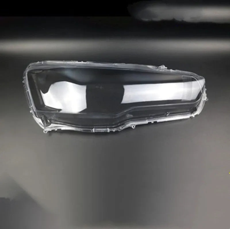 Transparent plastic car headlight housing cover with dimensions 50mm by 30mm by 20mm.