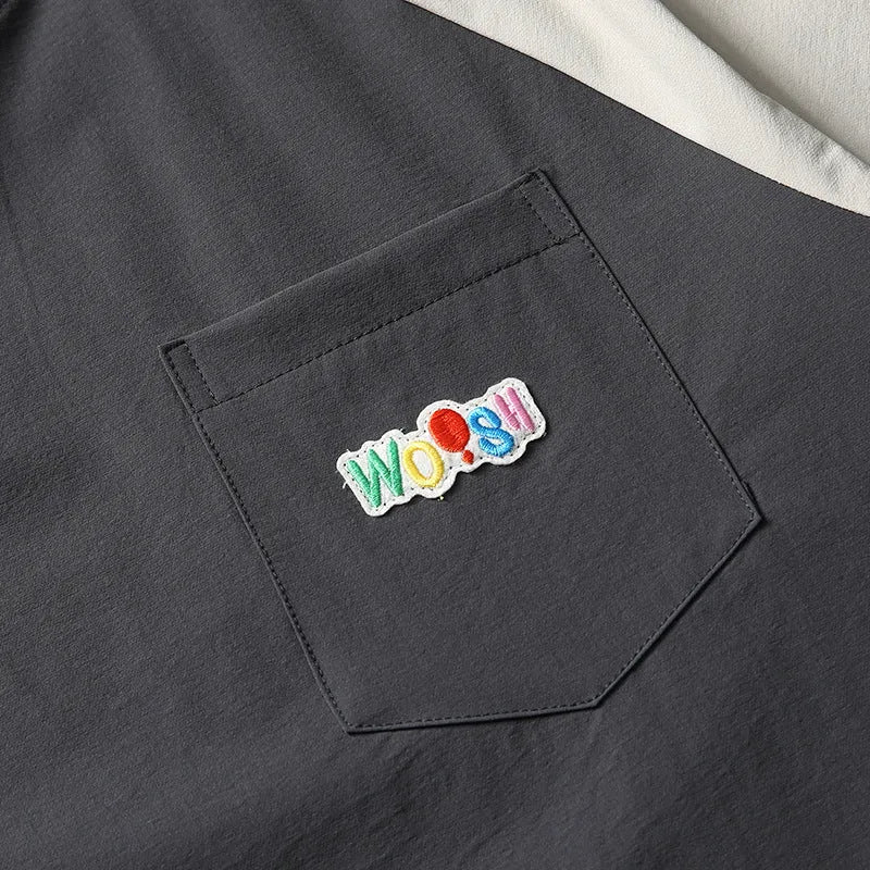 Dark grey men's loose fit t-shirt with contrasting colour raglan sleeves.