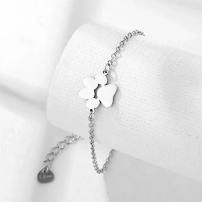 Stainless steel bracelet with a polished dog paw design, a stylish accessory for pet lovers