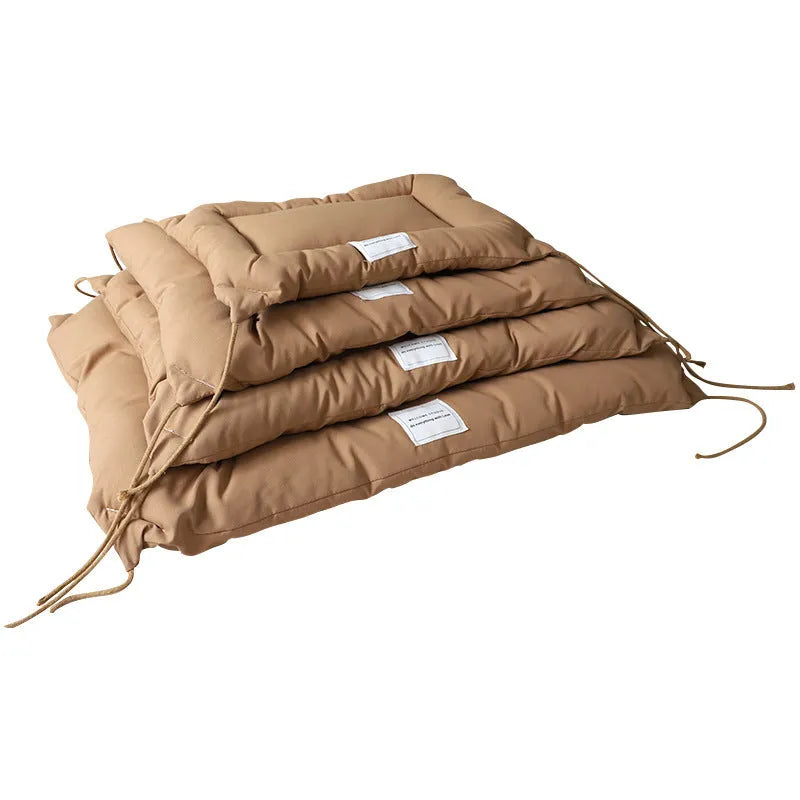 Beige cage cushion for dogs tied inside a metal crate, shown next to coffee and orange colour options.